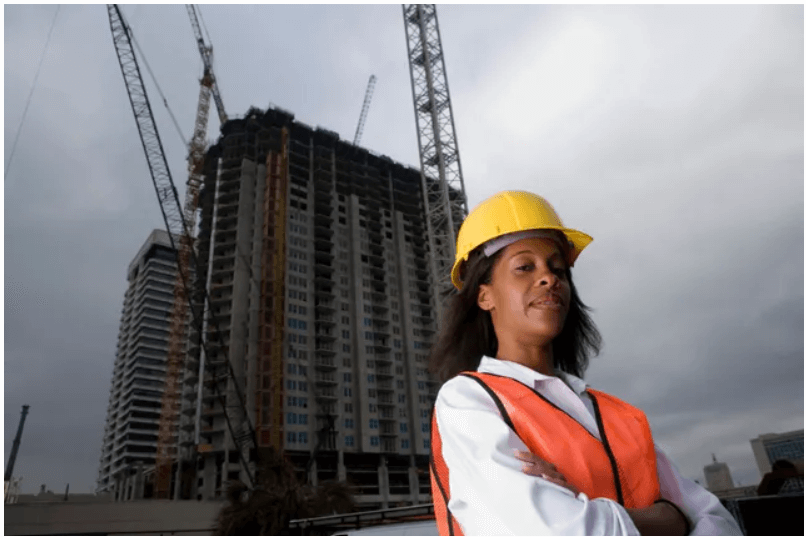 Engineer with hard hat at construction site.
