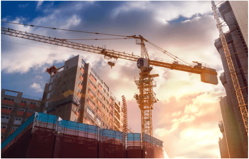 Construction site with crane and buildings.